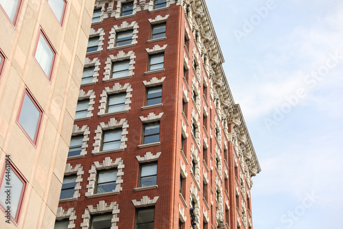 modern building, a symbol of urban growth and real estate prosperity, blends metal and stone to shape our skyline and secure mortgages for future dreams