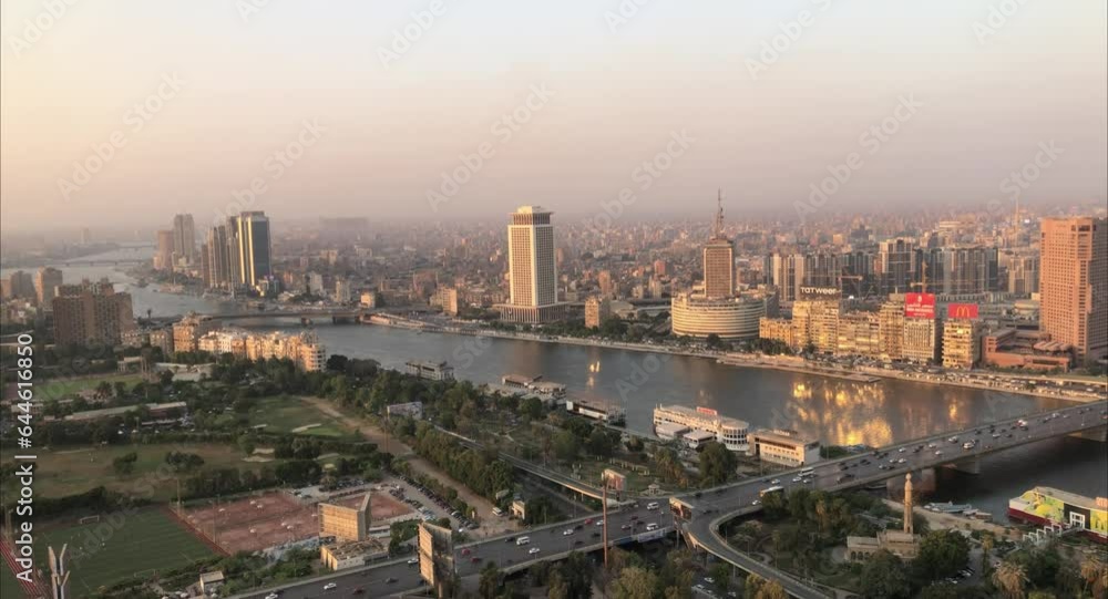 Cairo, Egyptpanoramic aerial sunset view of the Nile and downtown Cairo with traffic and boats seen from Cairo Tower - 29,Aug 2023.
Cairo, Egyptpanoramic aerial sunset view of the Nile and downtown Cairo with traffic and boats seen from Cairo Tower - 29,Aug 2023.