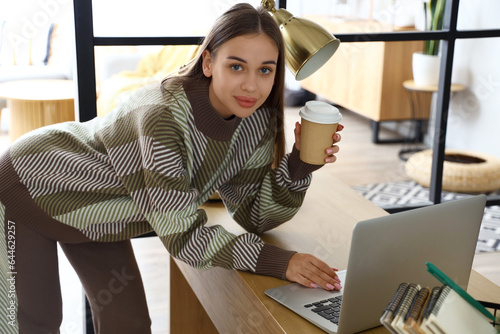 Young woman with cup of cof...
