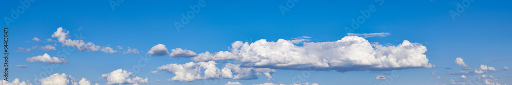 Blue sky background with white clouds. Cumulus white clouds. Panoramic widescreen image Blue sky background with white clouds. Cumulus white clouds. Panoramic widescreen image