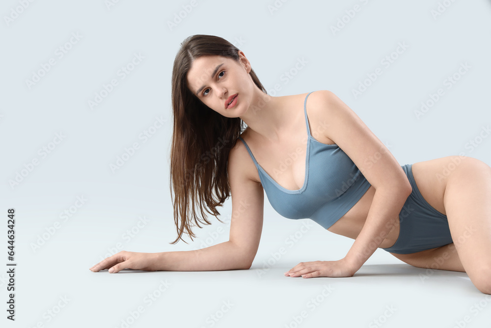 Beautiful woman in underwear on light background Beautiful woman in underwear on light background