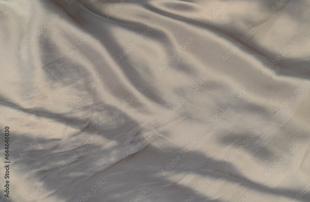 part of the fabric from beige-colored clothing part of the fabric from beige-colored clothing