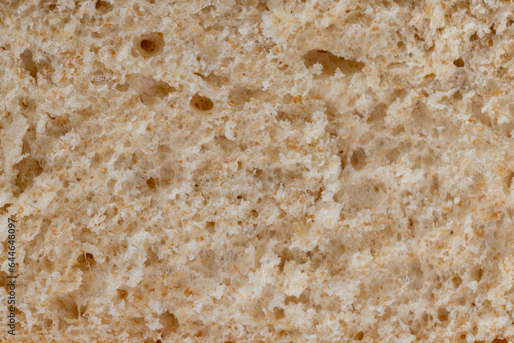 fresh wheat bread with bran on the cutting board fresh wheat bread with bran on the cutting board