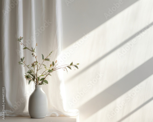 This scene showcases a product presented on a light gray textured fabric against a white wall. The gentle light from the window casts delicate, diffused shadows, giving a sense of softness © Justlight