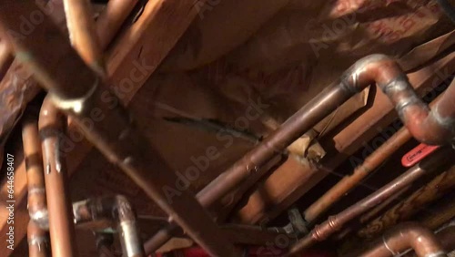 water leak gushing through pinhole in copper pipe in house