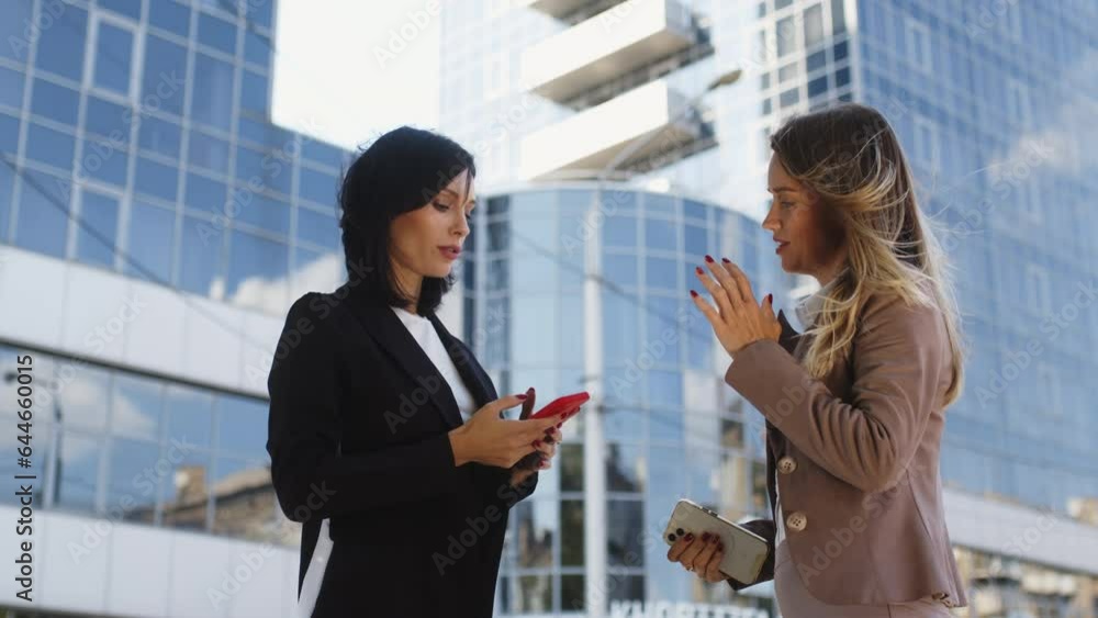 Business partners meet and chat outdoors. Business partners meet and chat outdoors.