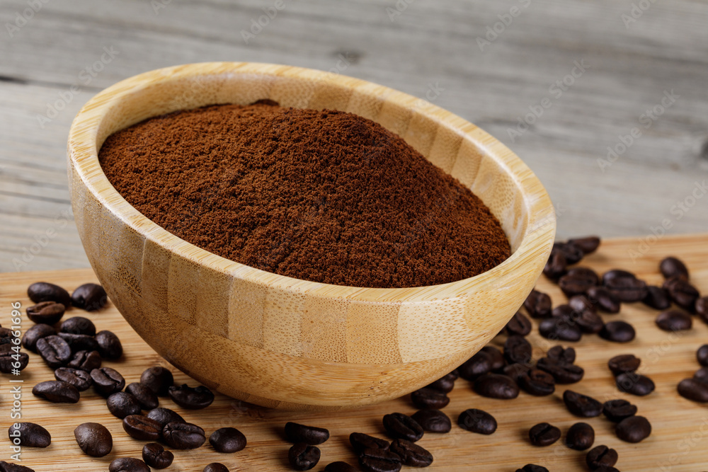 Close up of a wooden bowl of Fresh Ground Coffee Close up of a wooden bowl of Fresh Ground Coffee