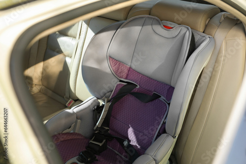 Empty modern child safety seat inside car