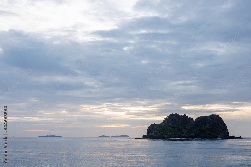little vomo island at sunset little vomo island at sunset