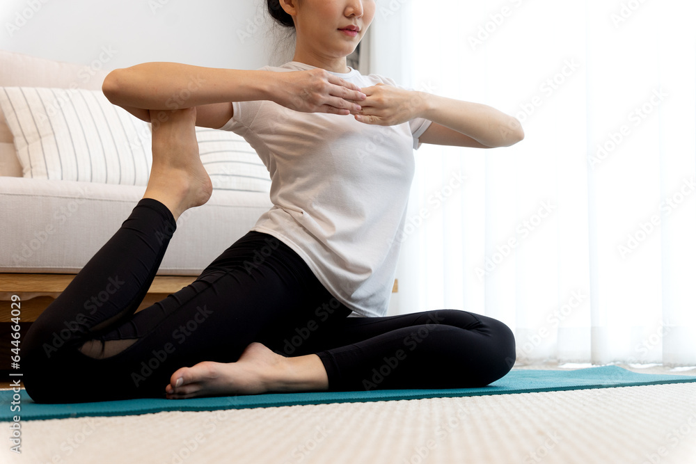 young woman stretching in a yoga pose for relaxation and self young woman stretching in a yoga pose for relaxation and self