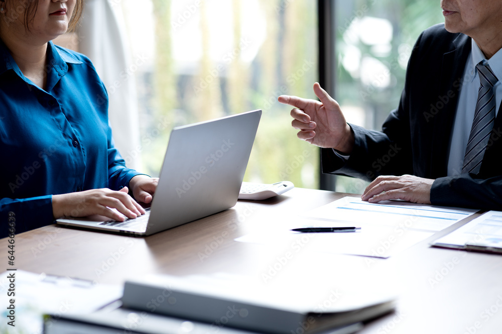 businessman giving a business lecture to a young businesswoman in business businessman giving a business lecture to a young businesswoman in business