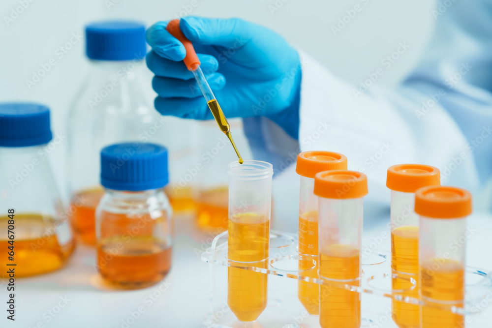 Close-up of laboratory technician conducting rigorous oil test, ensuring product integrity and safety, oil sample for quality control and purity testing, advancing petrochemical knowledge Close-up of laboratory technician conducting rigorous oil test, ensuring product integrity and safety, oil sample for quality control and purity testing, advancing petrochemical knowledge