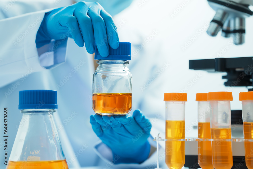 Close-up of laboratory technician conducting rigorous oil test, ensuring product integrity and safety, oil sample for quality control and purity testing, advancing petrochemical knowledge Close-up of laboratory technician conducting rigorous oil test, ensuring product integrity and safety, oil sample for quality control and purity testing, advancing petrochemical knowledge