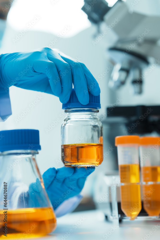 Close-up of laboratory technician conducting rigorous oil test, ensuring product integrity and safety, oil sample for quality control and purity testing, advancing petrochemical knowledge Close-up of laboratory technician conducting rigorous oil test, ensuring product integrity and safety, oil sample for quality control and purity testing, advancing petrochemical knowledge