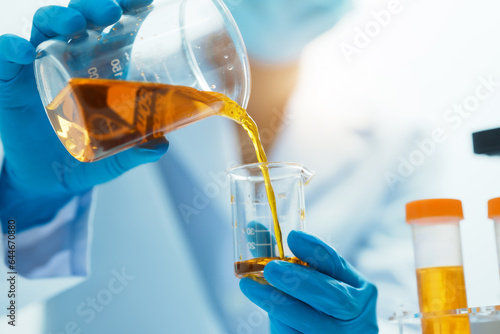 Close-up of laboratory technician conducting rigorous oil test, ensuring product integrity and safety, oil sample for quality control and purity testing, advancing petrochemical knowledge