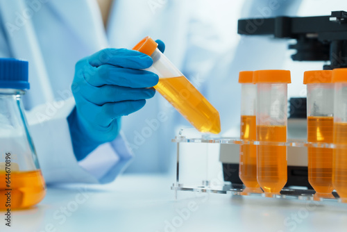 Close-up of laboratory technician conducting rigorous oil test, ensuring product integrity and safety, oil sample for quality control and purity testing, advancing petrochemical knowledge