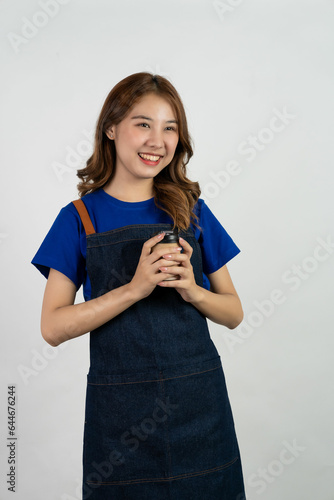 Cheerful  friendly  assertive  young Asian girl wearing a light blue t-shirt  relaxed  carefree  poses against a white background.