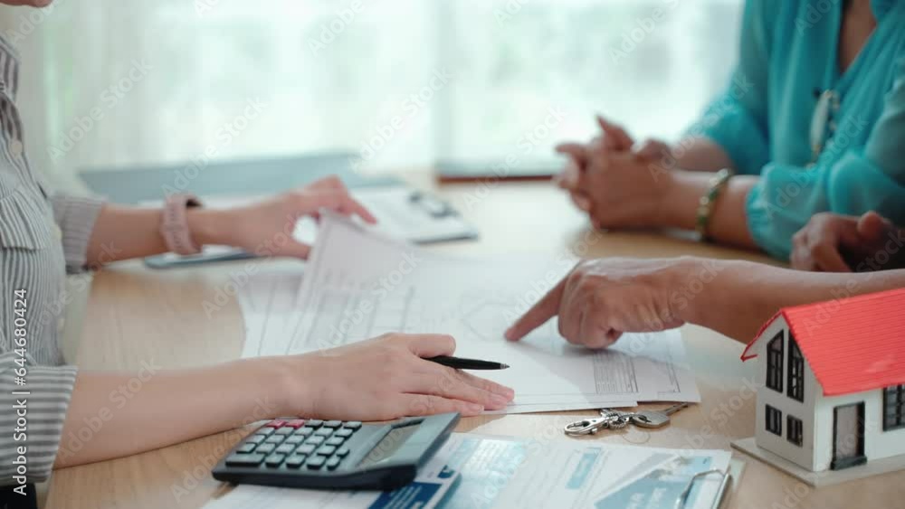 realtor bringing real estate insurance contract for elderly couple to sign documents at home