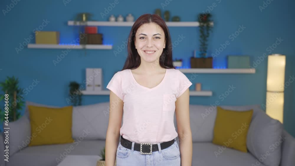 Woman making positive gesture at camera. Woman making positive gesture at camera.