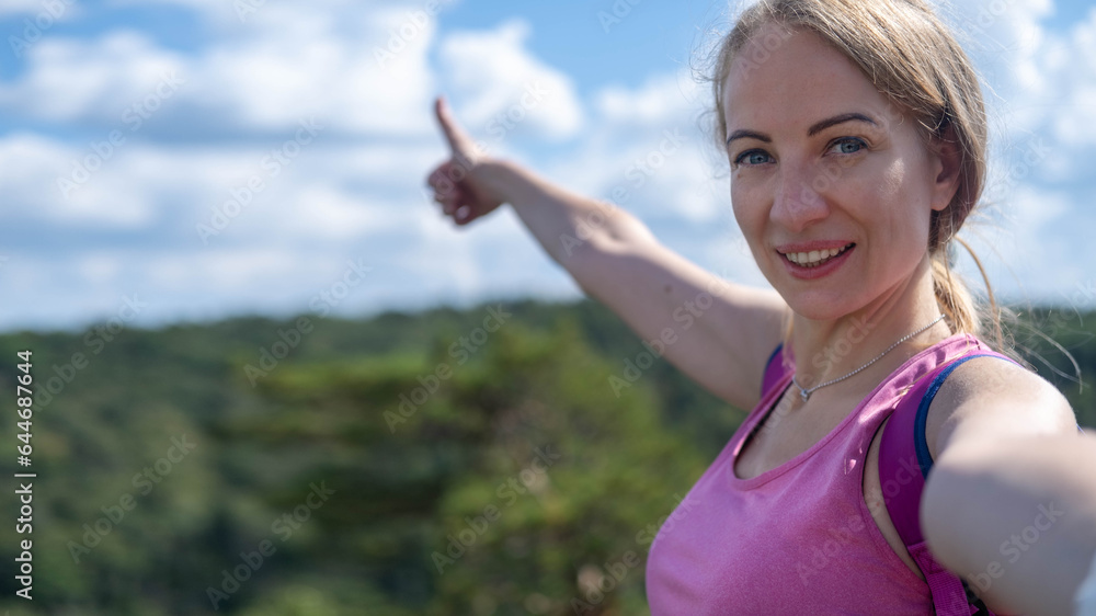 Young beautiful hiker woman taking selfie portrait on the top of mountain - Happy smiling girl using her smartphone - Hiking and climbing cliff. Young beautiful hiker woman taking selfie portrait on the top of mountain - Happy smiling girl using her smartphone - Hiking and climbing cliff.