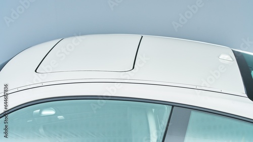 Sunroof of a white sports car from the drivers side