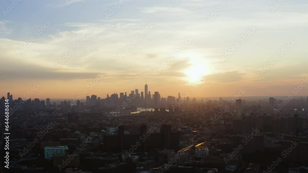 Aerial view overlooking the New York and Brooklyn city metropolis, during sunset Aerial view overlooking the New York and Brooklyn city metropolis, during sunset