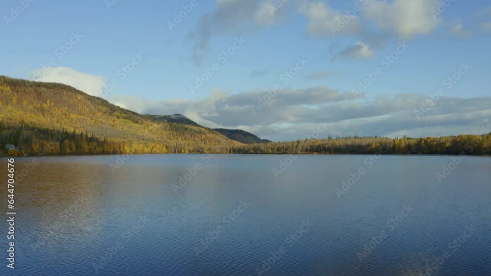 A moving aerial drone shot of Seymour Lake over the center in the Smithers area in northern BC during the autumn months. A moving aerial drone shot of Seymour Lake over the center in the Smithers area in northern BC during the autumn months.