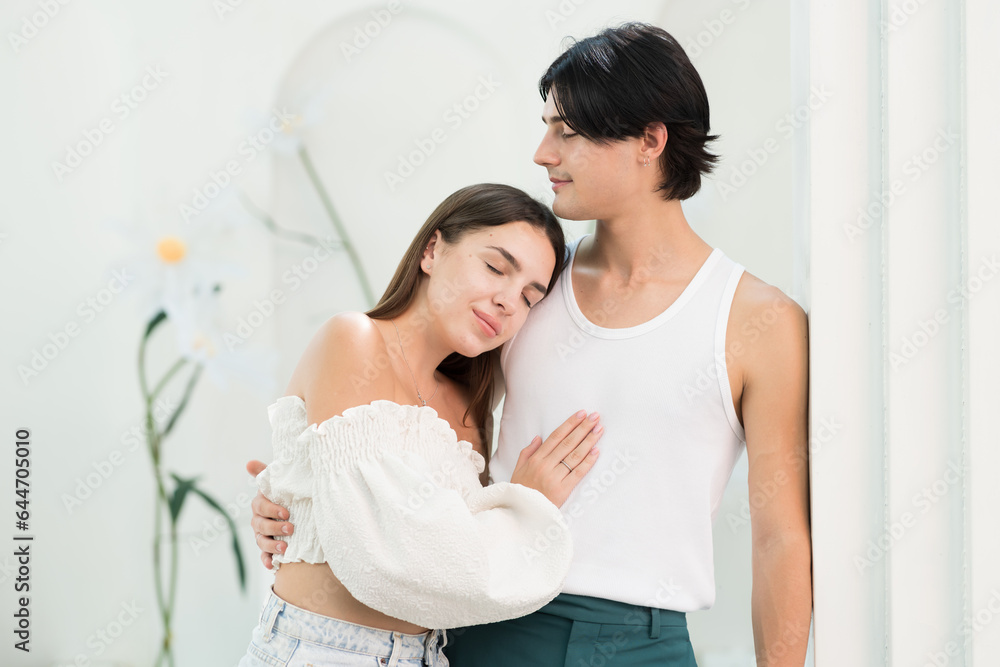 Young male and female couple embrace together with happy and smiling in garden at home Young male and female couple embrace together with happy and smiling in garden at home