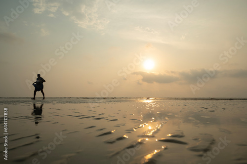 sunset in the seashore of Bakkhali. Beautiful beach landscape. Dreamy sunset sky calm tranquil relax sunset summer mood. 03.28.2023. Bakkhali, South 24 Parganas, West bengal, India.