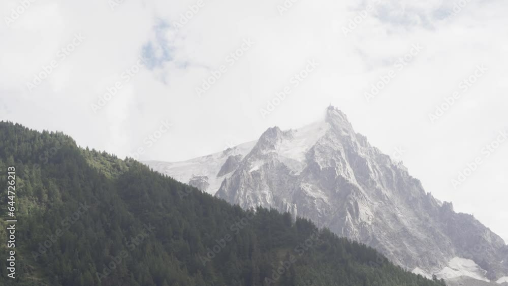 Aiguille du Midi Mountain In The Mont Blanc Massif With Cloudy Sky In The Background In France. - wide Aiguille du Midi Mountain In The Mont Blanc Massif With Cloudy Sky In The Background In France. - wide
