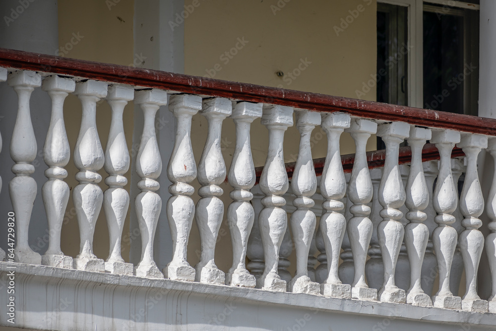 Fencing on the balcony of an abandoned building on an autumn day Fencing on the balcony of an abandoned building on an autumn day