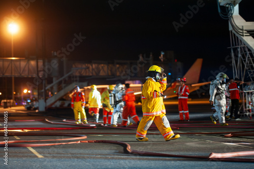 Firefighters are working in the airport at night. from the accident situation