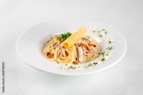 Spaghetti in a dish on a white background from Italy pasta lunch with tomato sauce

