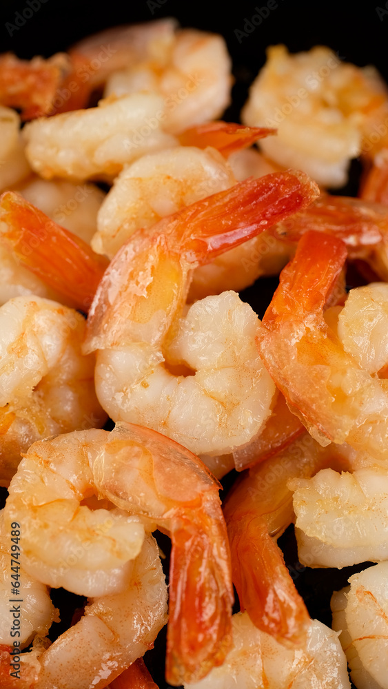 Fresh shrimps fried in oil pan, close up Fresh shrimps fried in oil pan, close up