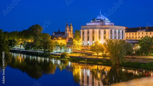 Cityscape view of the famous architecture illuminated at night on the Loire riverside in Tours city in France