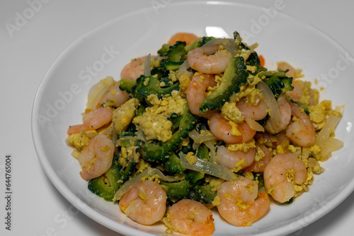 Ginisang ampalaya. sauteed bitter melon or bitter gourd with shrimp and egg.  photo