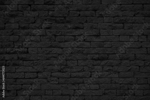 Old black brick wall texture. Grunge background