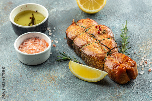 Fresh cooked delicious salmon steak on a wooden board, banner, menu, recipe place for text, top view