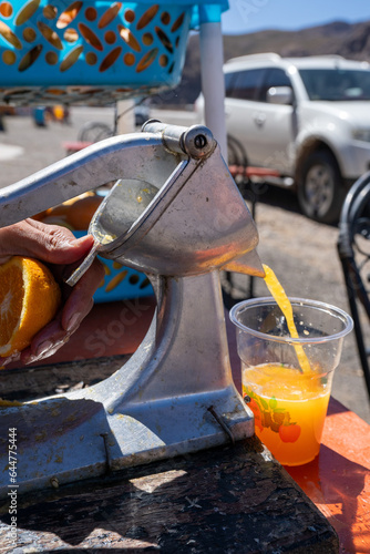 Fresh Orange Juice being prepared in the Atlas Mountains in Morocco © Peter