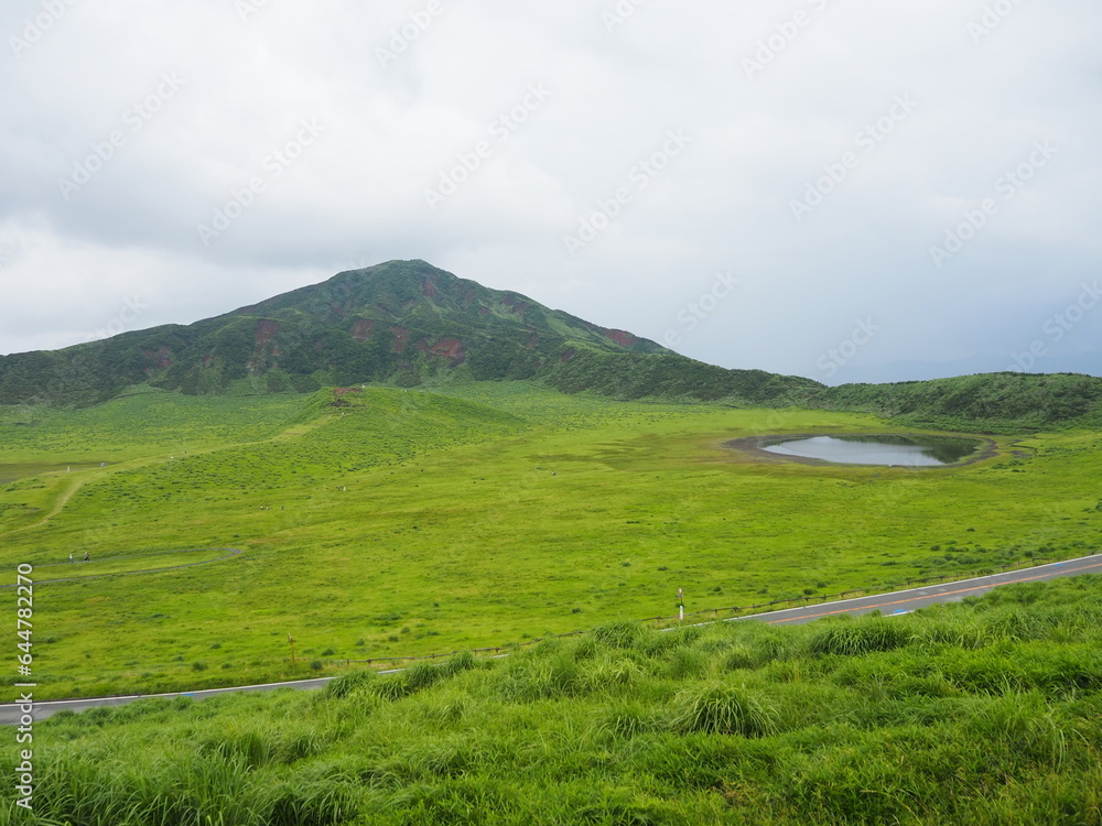 Kusasenri-ga-hama includes a rain fed pool and a 785,000-square-meter grassland growing inside an inactive crater in the foothills of Mt. Eboshi