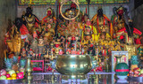 Figurines of deities in chinese Jui Tui temple in Phuket, Thailand. Shrine worship shelf with many gods, selective focus