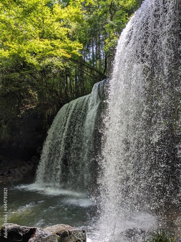 The Nabegataki Falls  where travelers can access the large cavern behind the falls