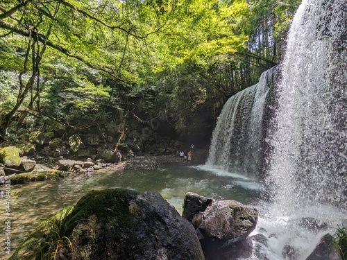 The Nabegataki Falls, where travelers can access the large cavern behind the falls photo