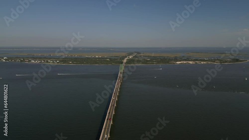 Wallpaper Mural An aerial view of the Fire Island Inlet Bridge on a beautiful day. The camera dolly in high up along the bridge and the Robert Moses Causeway heading to the mainland as a few cars drive by. Torontodigital.ca