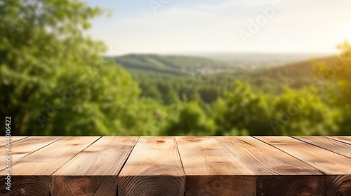 Wooden table in front of blurred autumn foliage background. Ready for product display montage	