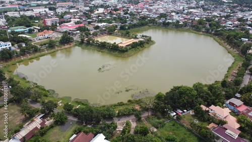 Aerial view of green fields and farmlands in rural Thailand.