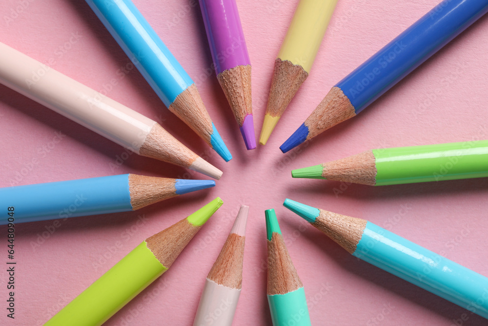 Colored wooden pencils on a pink background. Colored wooden pencils on a pink background.