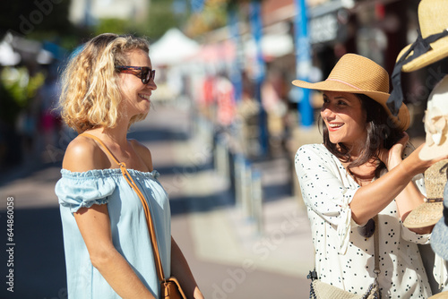 two friends girls have fun while shopping outdoor flea market © auremar