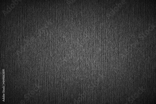 Grey graphite acrylic canvas background. Blank burlap-textured paper weave background with vignette and light center. Top view