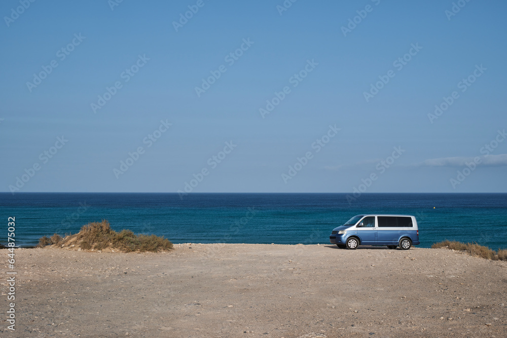 Van parked on beach